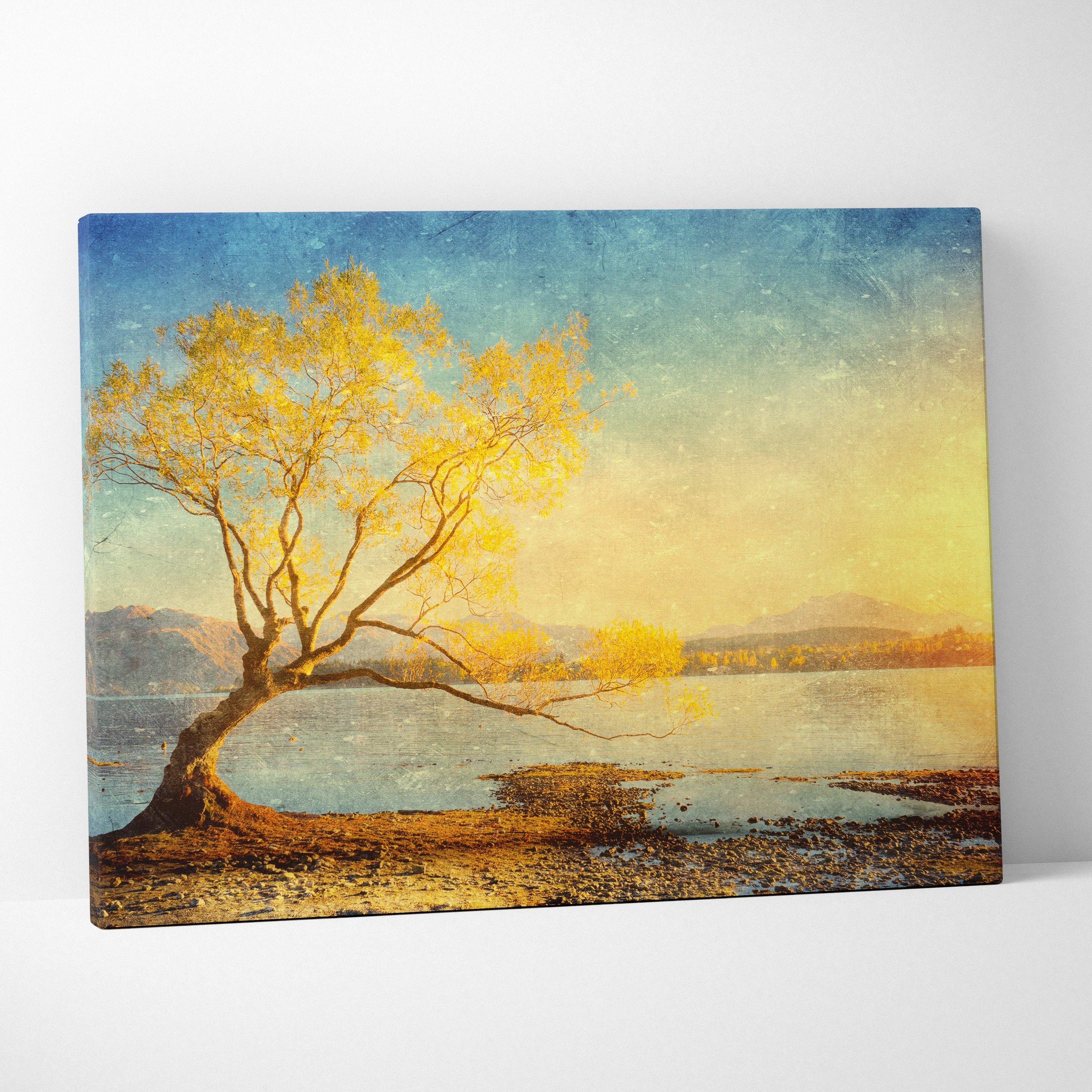 Golden lake tree sunset canvas wall art print with solitary tree and golden leaves over calm water in teal blue mountain style