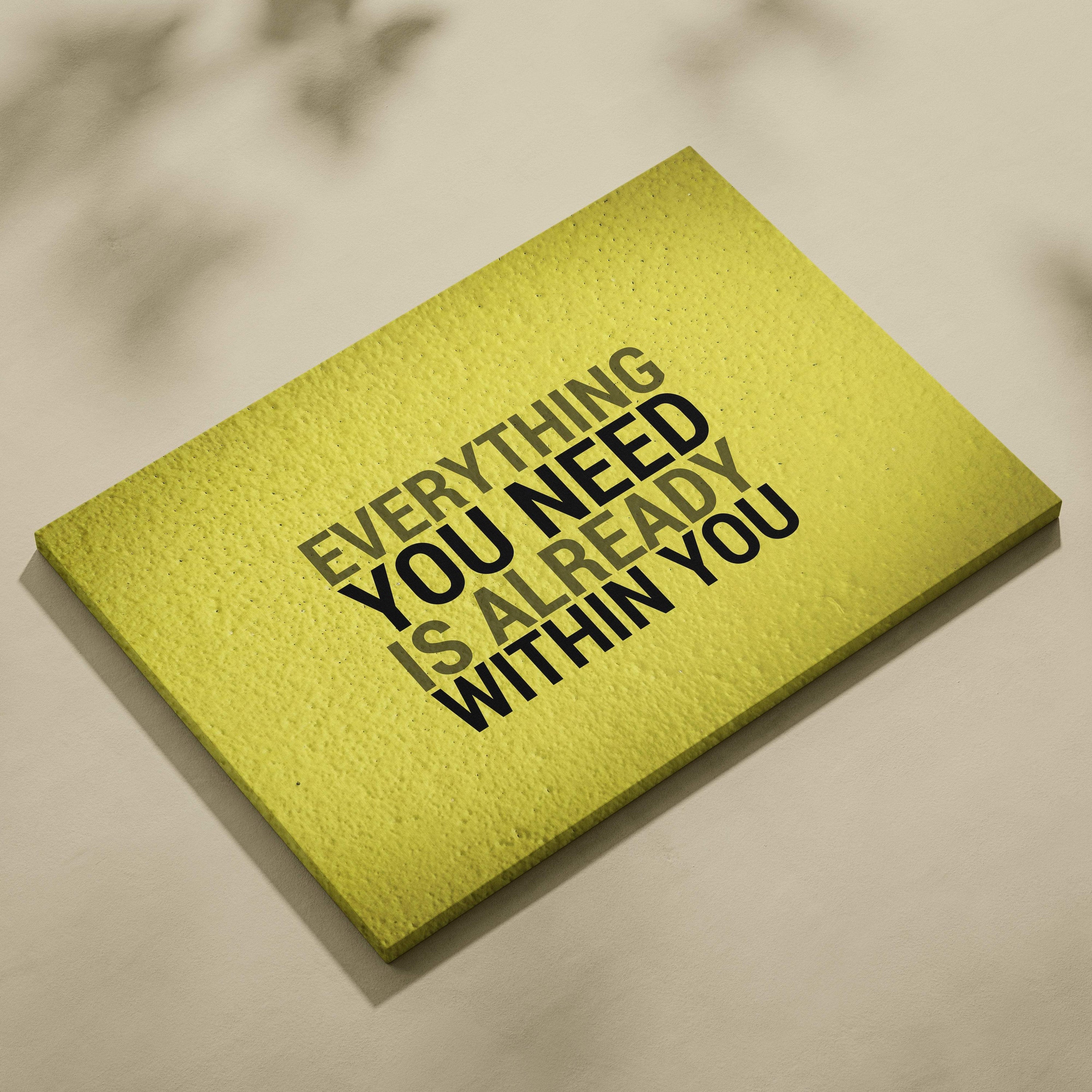 Matte yellow rectangular plaque with motivational everything you need is already within you printed in bold black letters