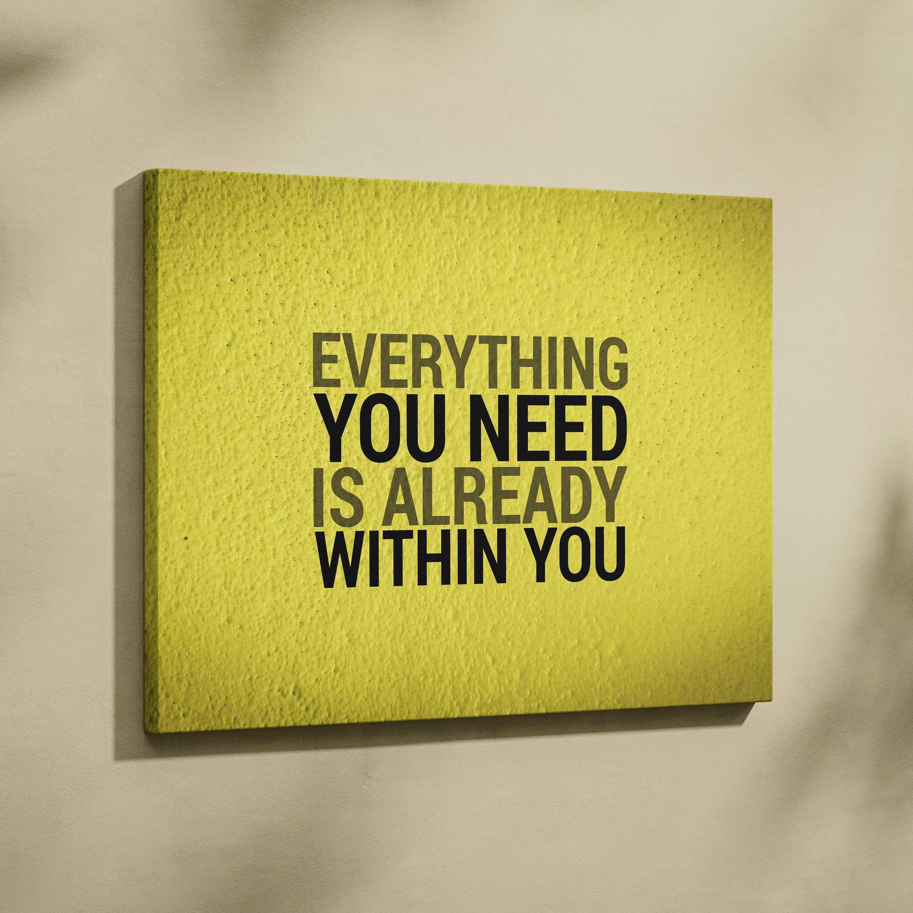 Textured vibrant yellow canvas wall art with the motivational quote everything you need is already within you in bold lettering