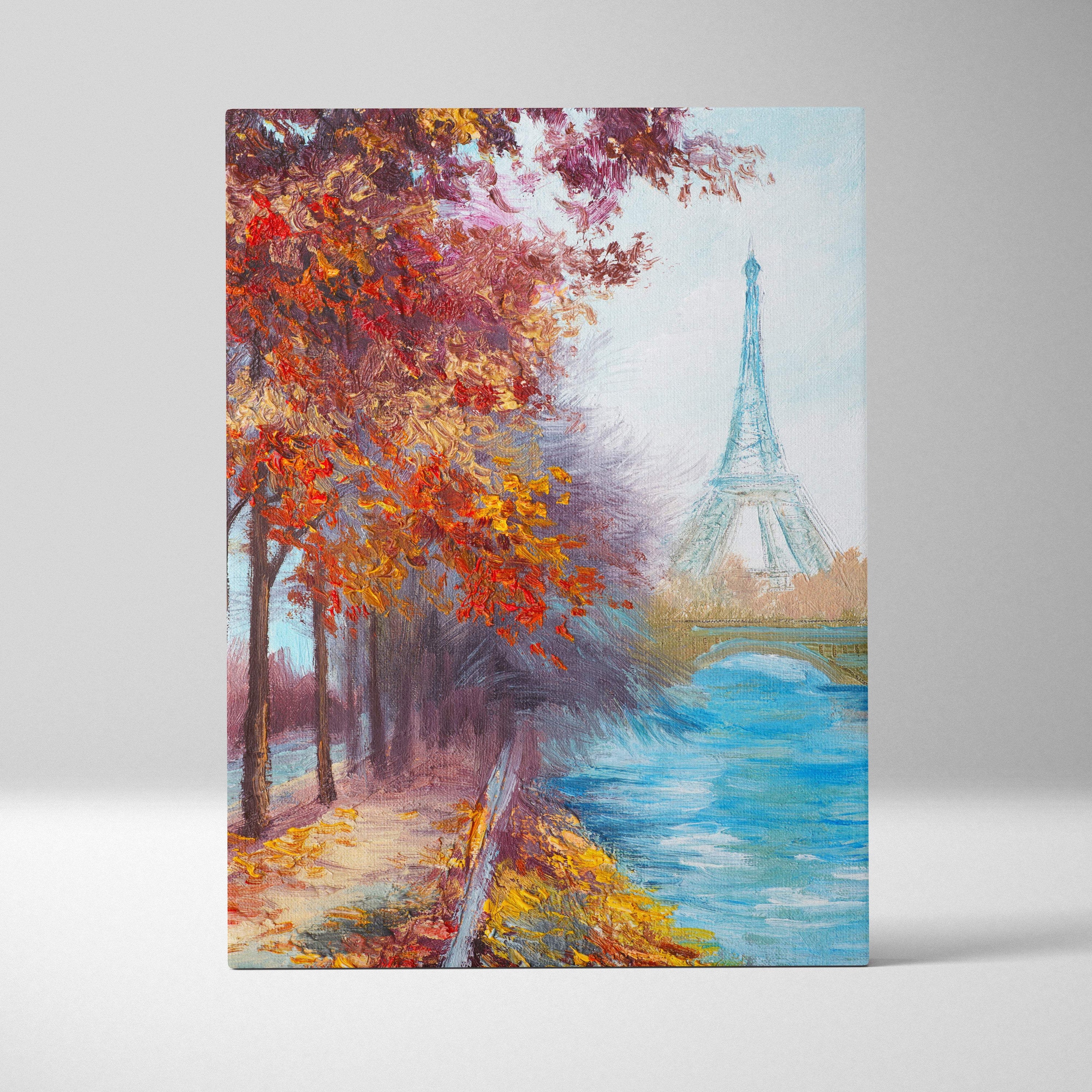 A vibrant autumnal canvas print of the eiffel tower with fiery red orange trees along a soft blue riverbank