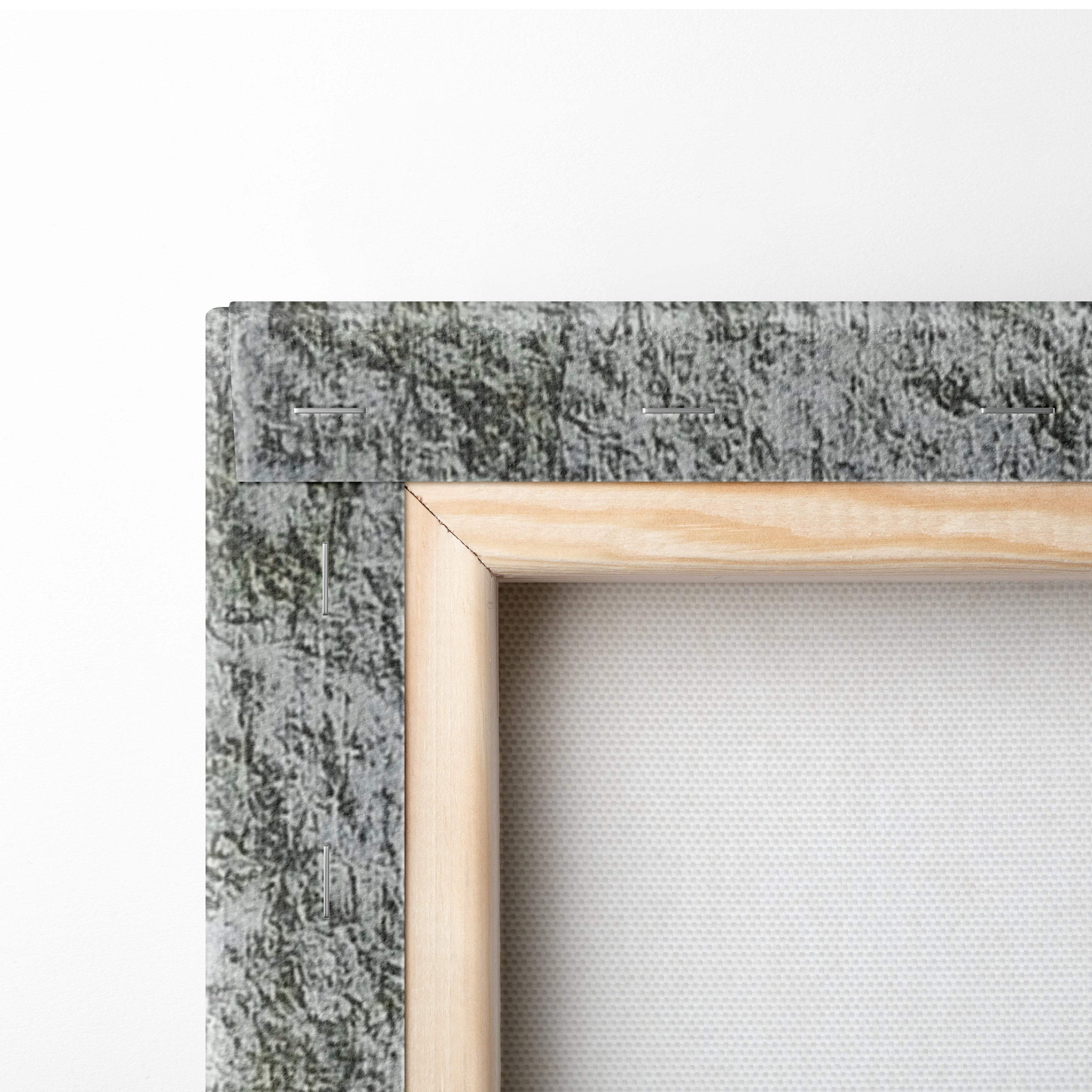 Light-colored wooden frame with textured gray fabric backing of motivational typography wall art print for office decor