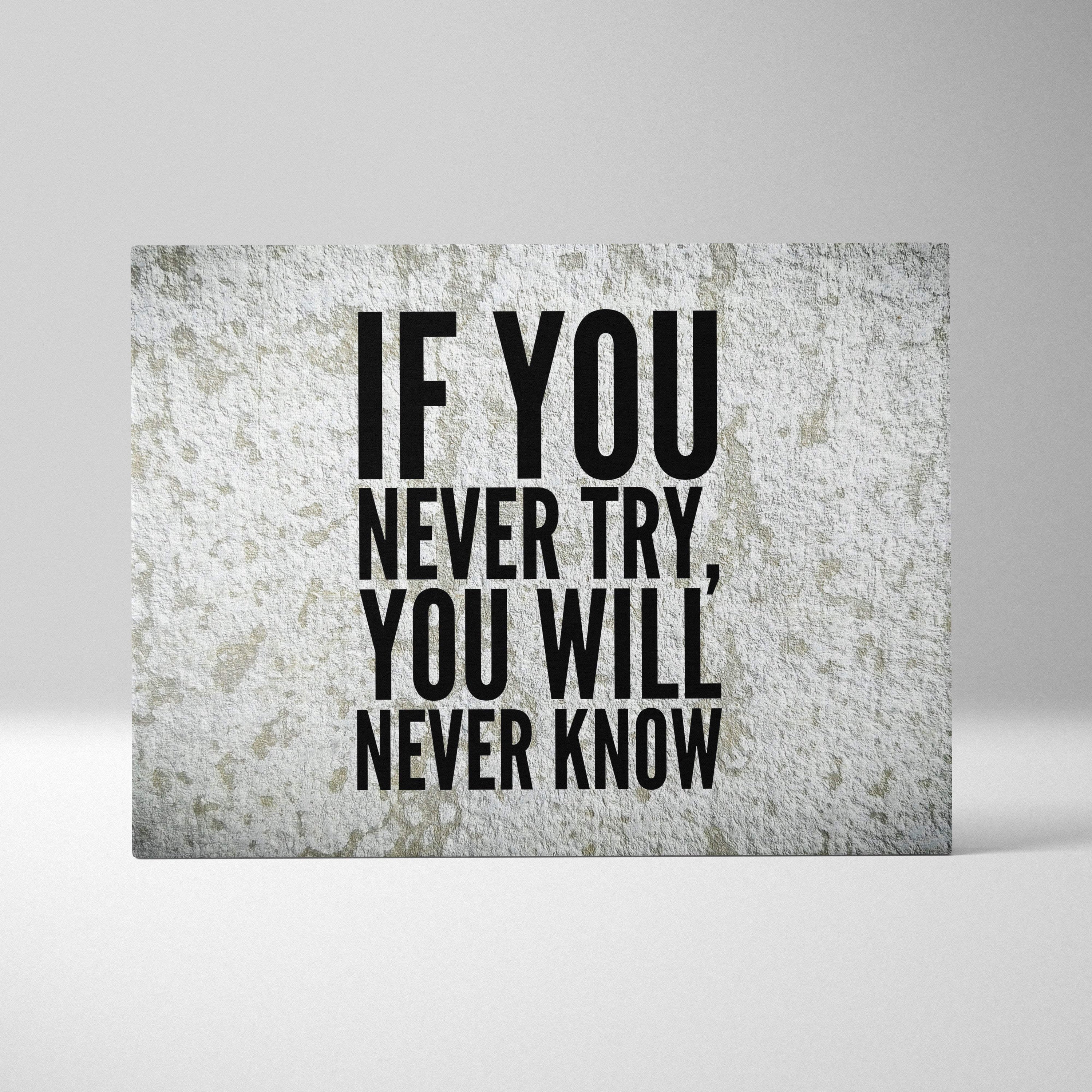 A rectangular canvas print with bold black motivational typography on textured gray concrete for office decor