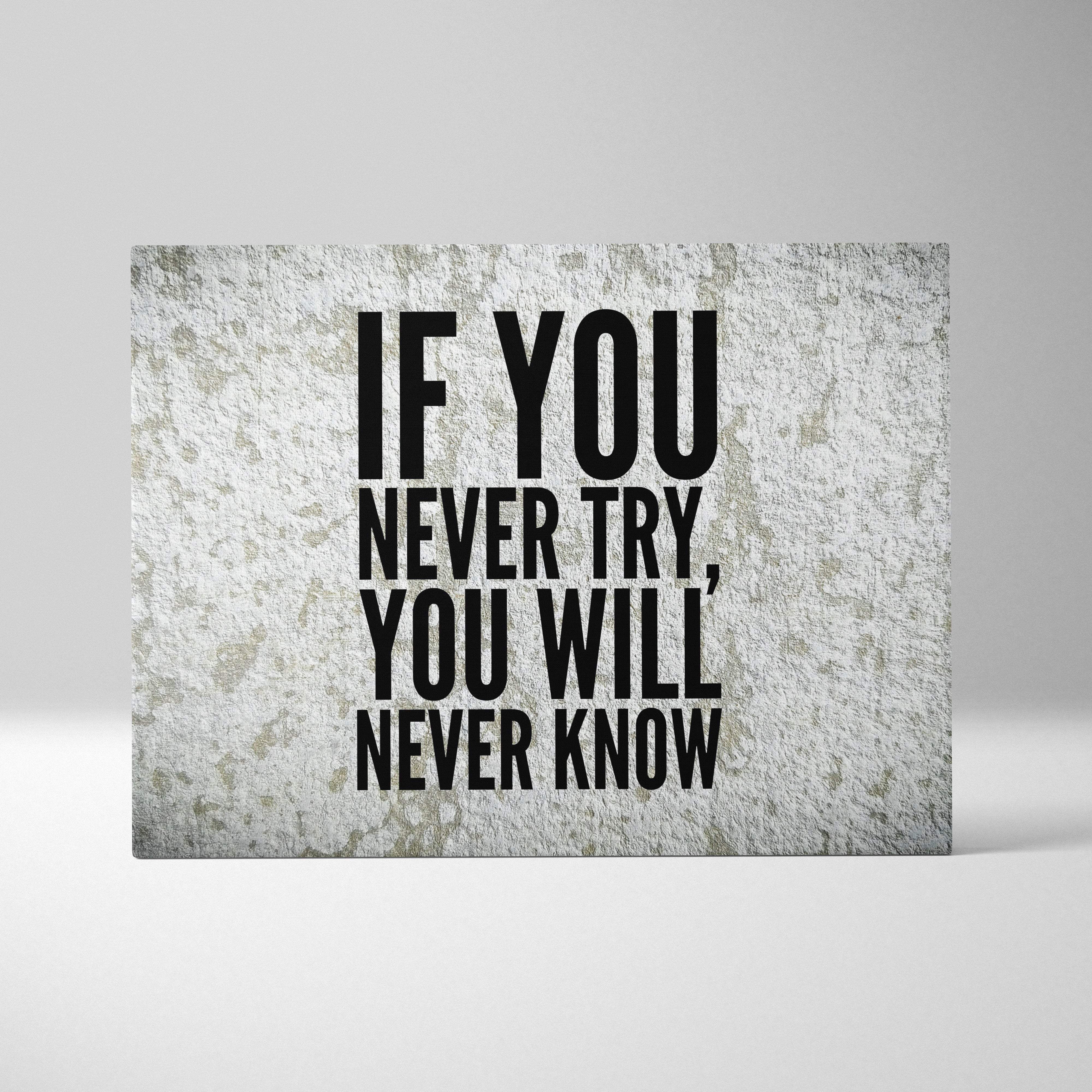 A rectangular canvas print with bold black motivational typography on textured gray concrete for office decor