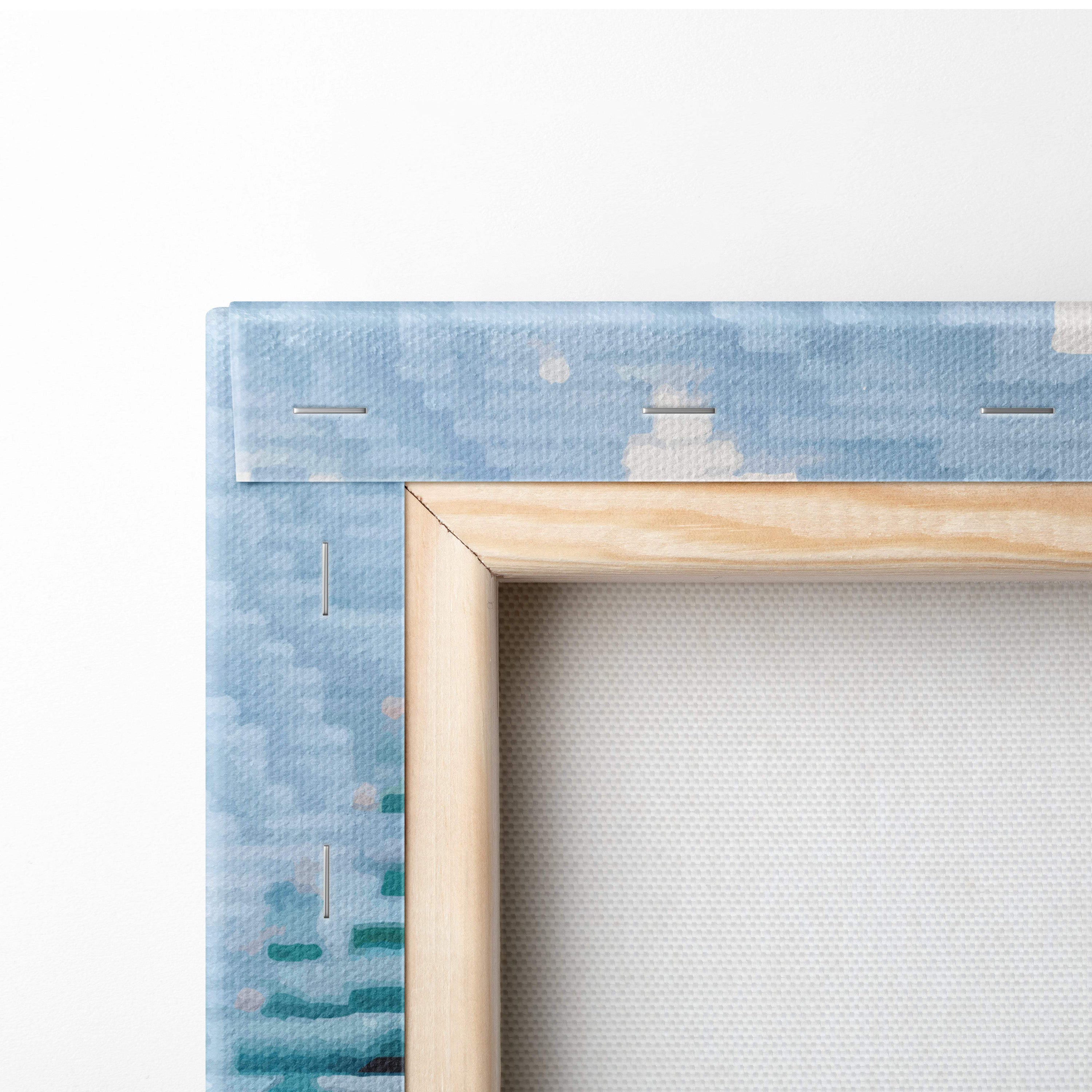 Light wood-framed canvas print with blue teal abstract watercolor border featuring snowy village pixel art design
