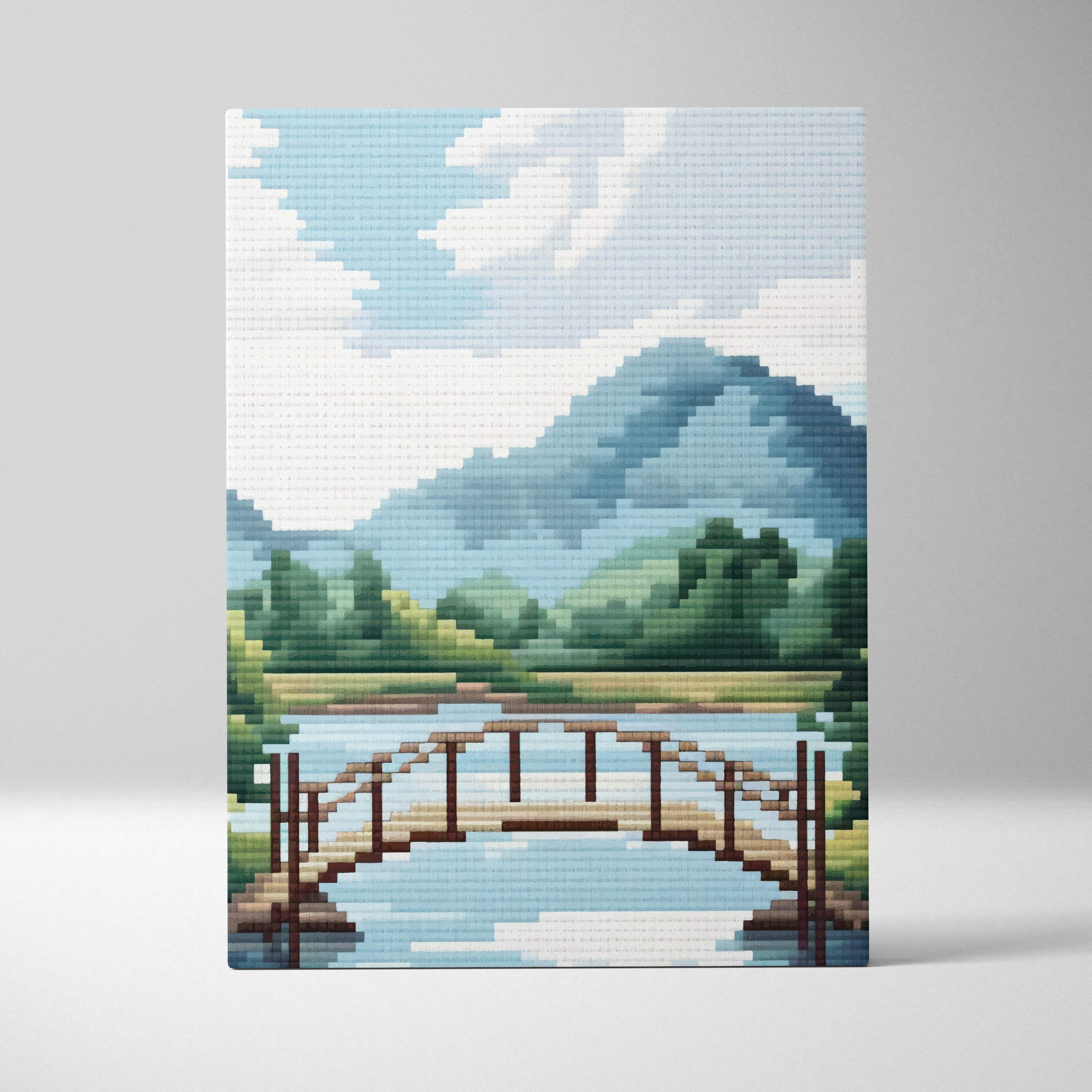 Mountain lake bridge pixel art canvas print showing a wooden arched bridge over blue water with green hills and mountains