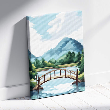 Mountain lake bridge pixel art canvas print showing a wooden bridge over a blue river with green hills and mountains