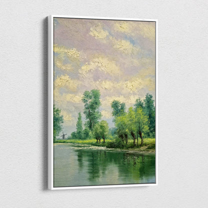 A framed impressionist canvas print of tranquil riverside landscape with lush green trees and pastel textured sky