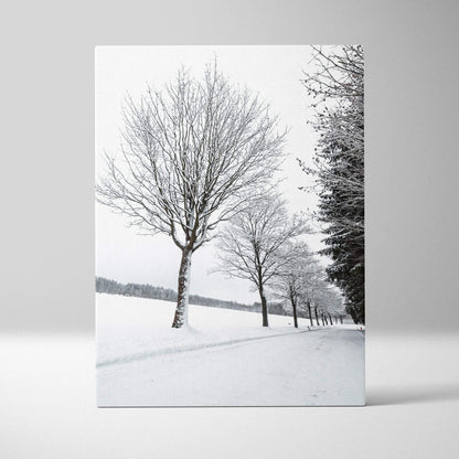 Vertical canvas wall art featuring snowy trees in a winter landscape for home decor.