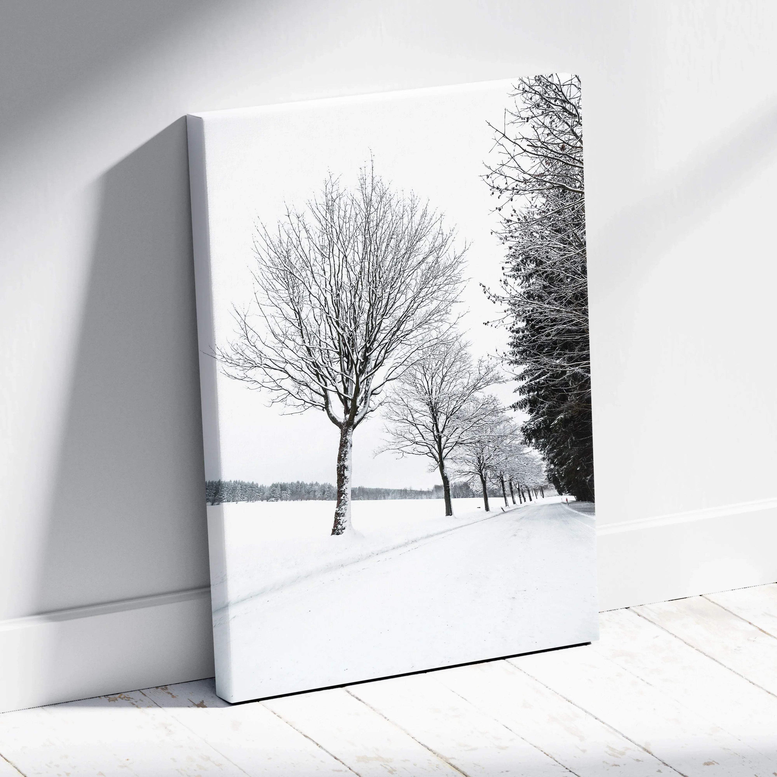 Canvas wall art featuring a serene winter scene with snow-covered trees and a peaceful snowy landscape decor.