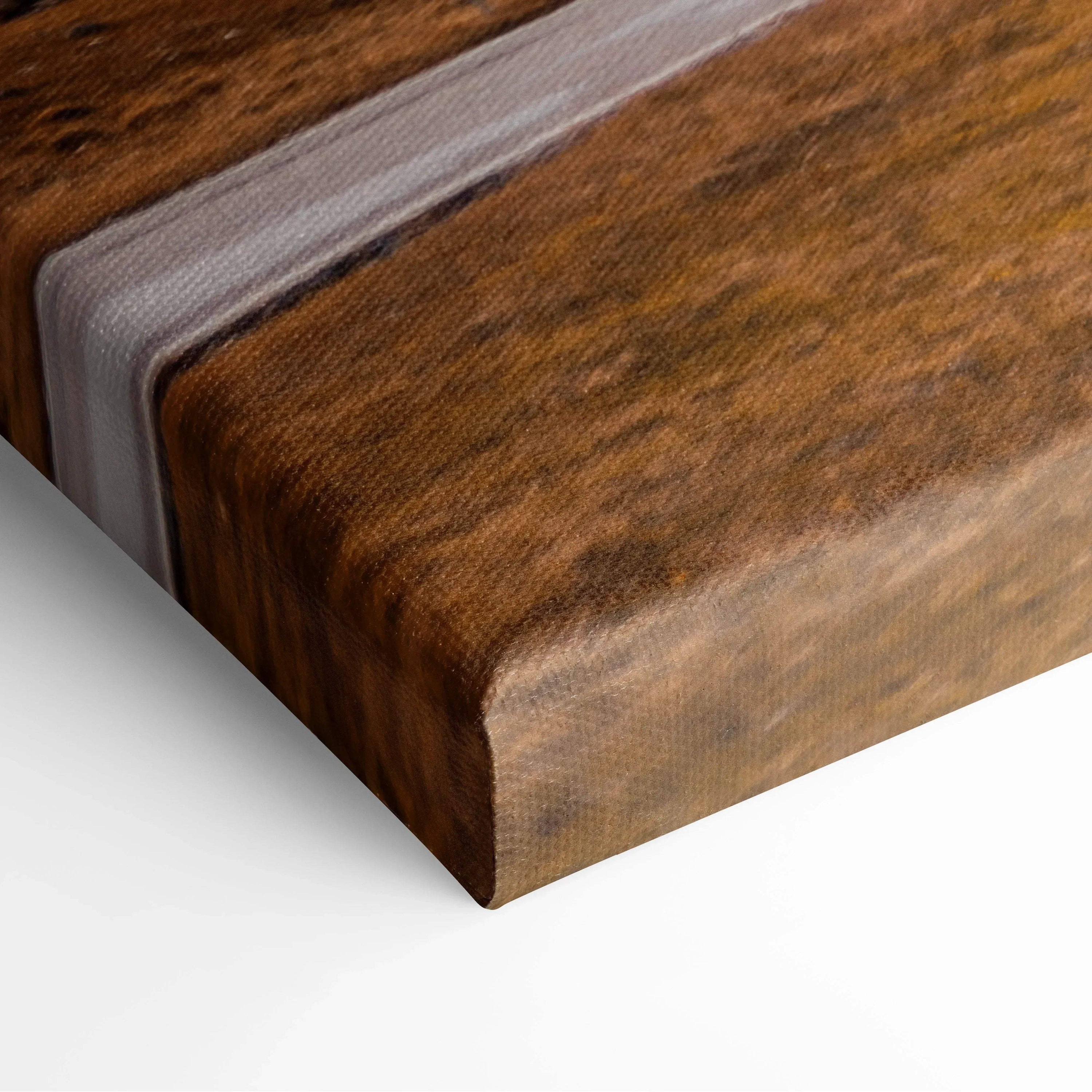 Close-up of textured brown canvas art with sharp wrapped edges for wall art display.