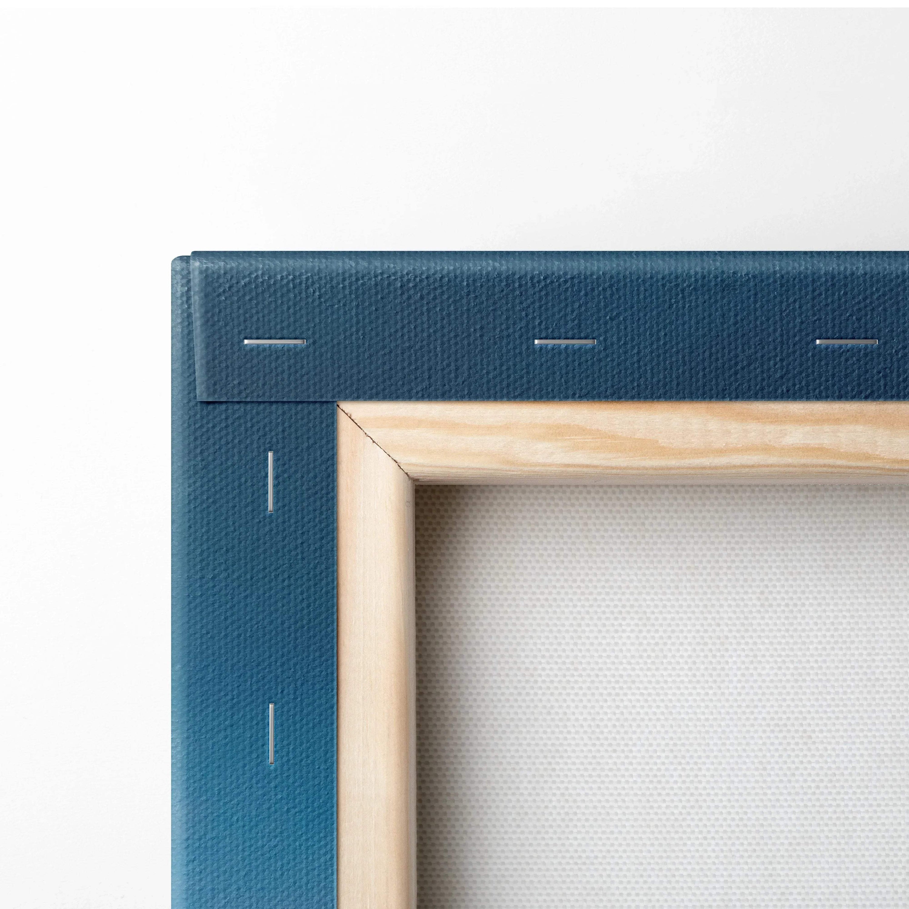 Corner close-up of stretched canvas with wooden frame and blue fabric backing for wall art canvas print.