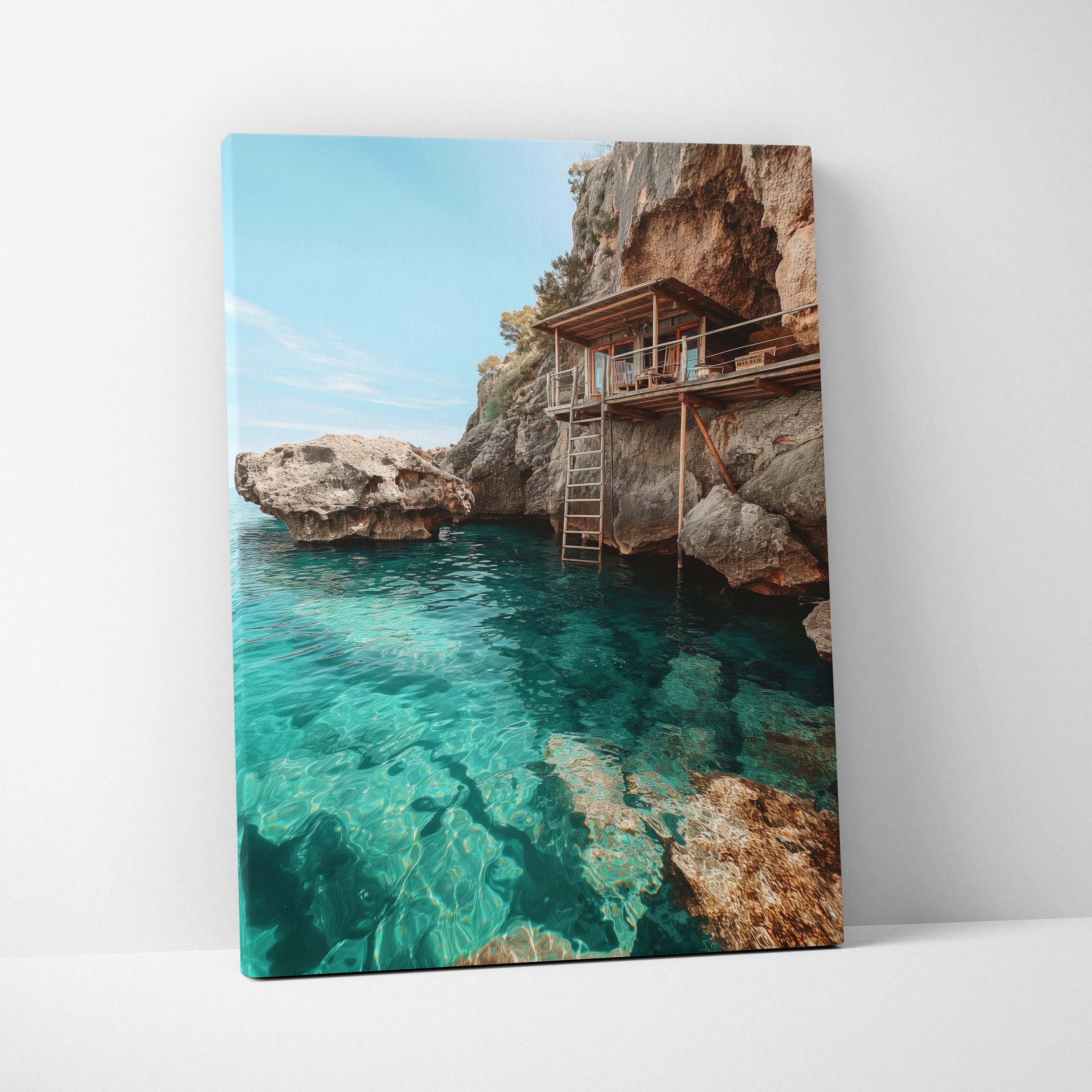 Canvas wall art featuring a serene beach scene with clear turquoise water and rocky cliffs under a blue sky.