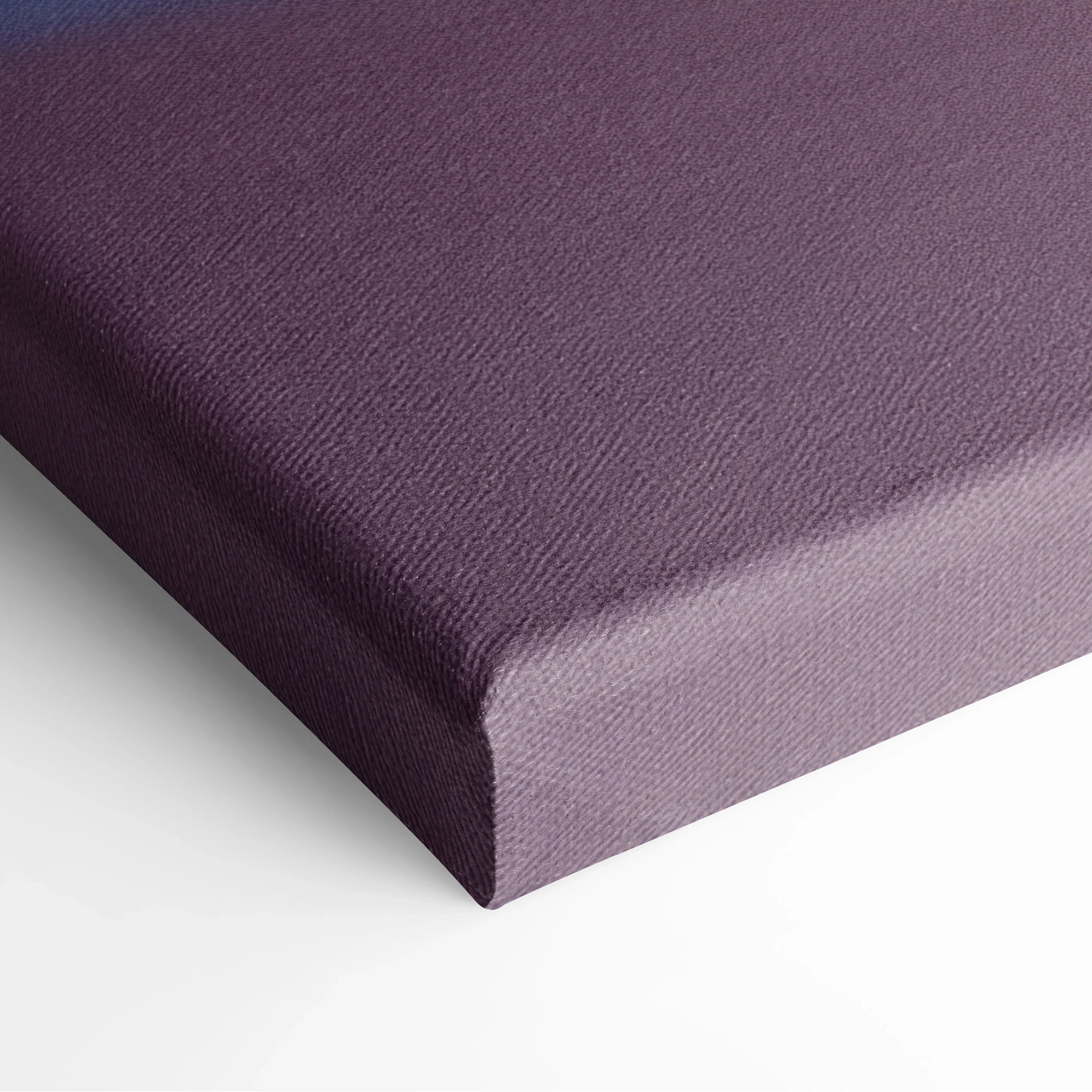 Close-up of purple stretched canvas corner with textured fabric for wall art display.