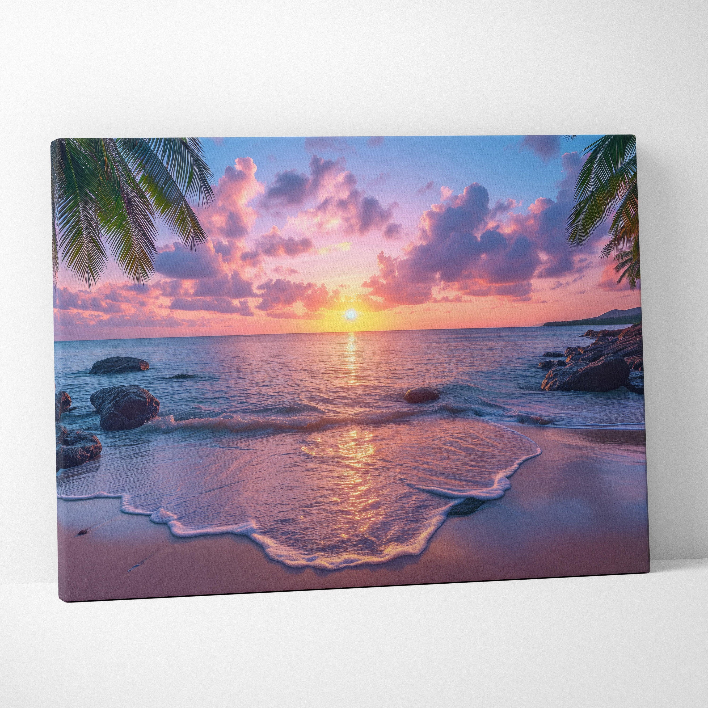 Canvas wall art featuring a vibrant beach sunset with pink and purple skies, reflective water, and palm leaves framing the.