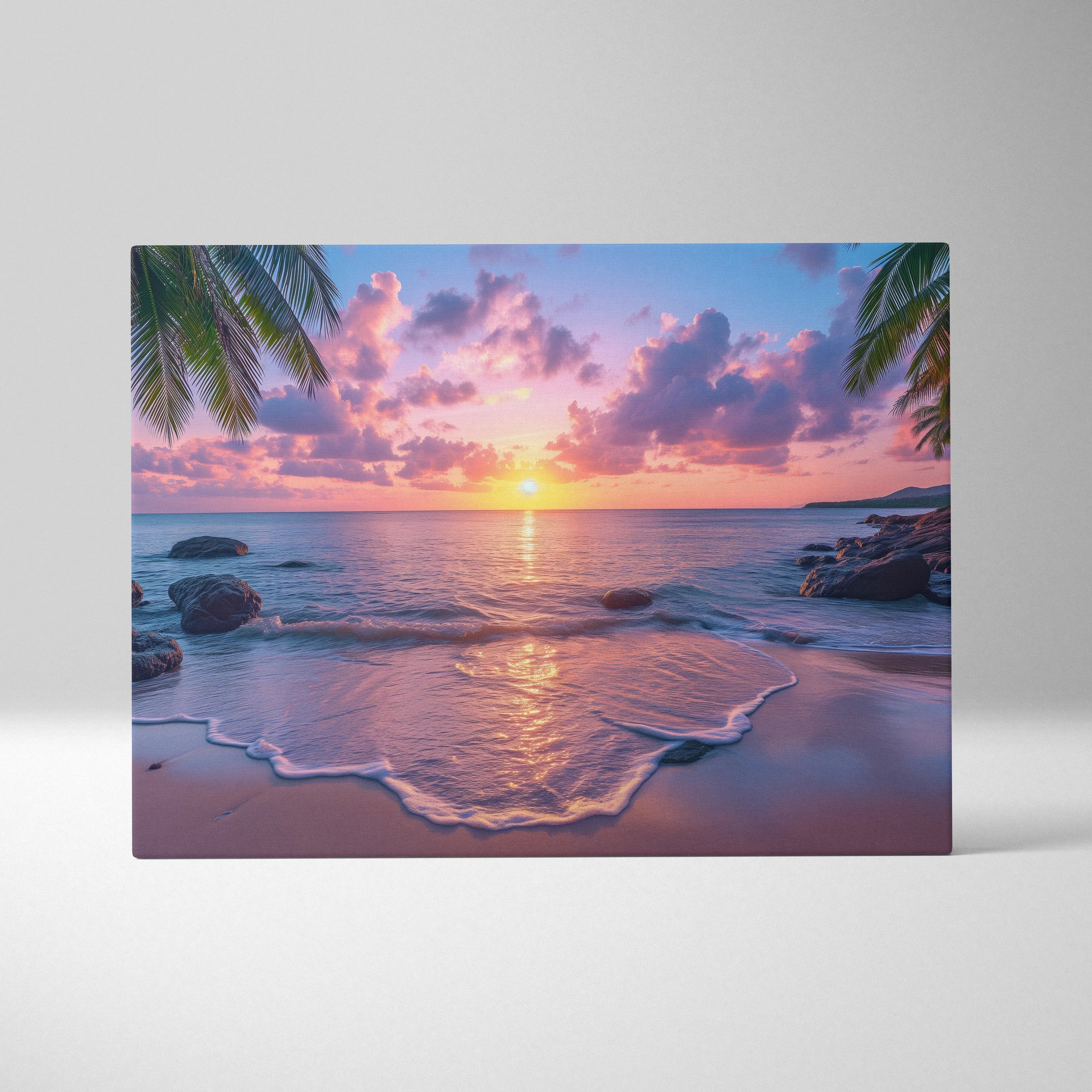 Canvas wall art depicting a vibrant beach sunset with pink and purple clouds, calm ocean waves, and palm fronds framing the.