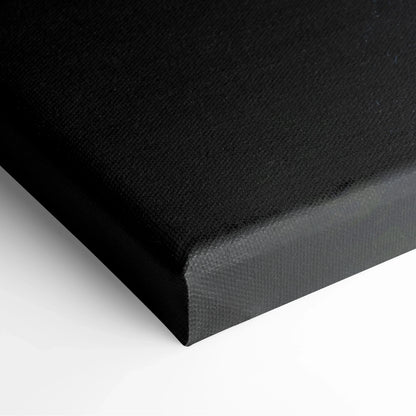 Close-up of black stretched canvas corner with textured surface and clean edges for wall art decor.