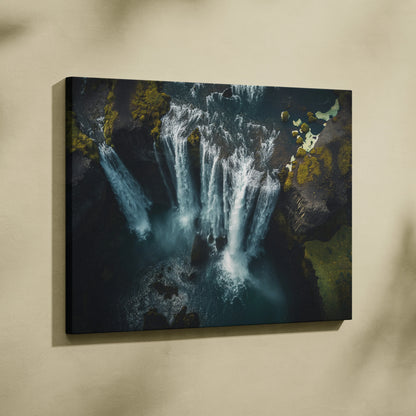Iceland waterfall canvas wall art with high-resolution nature scene in dark, moody tones for decor.