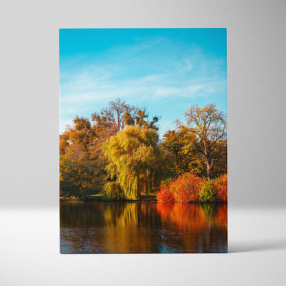 Autumn nature scene canvas wall art with colorful trees reflecting on calm water under blue sky.