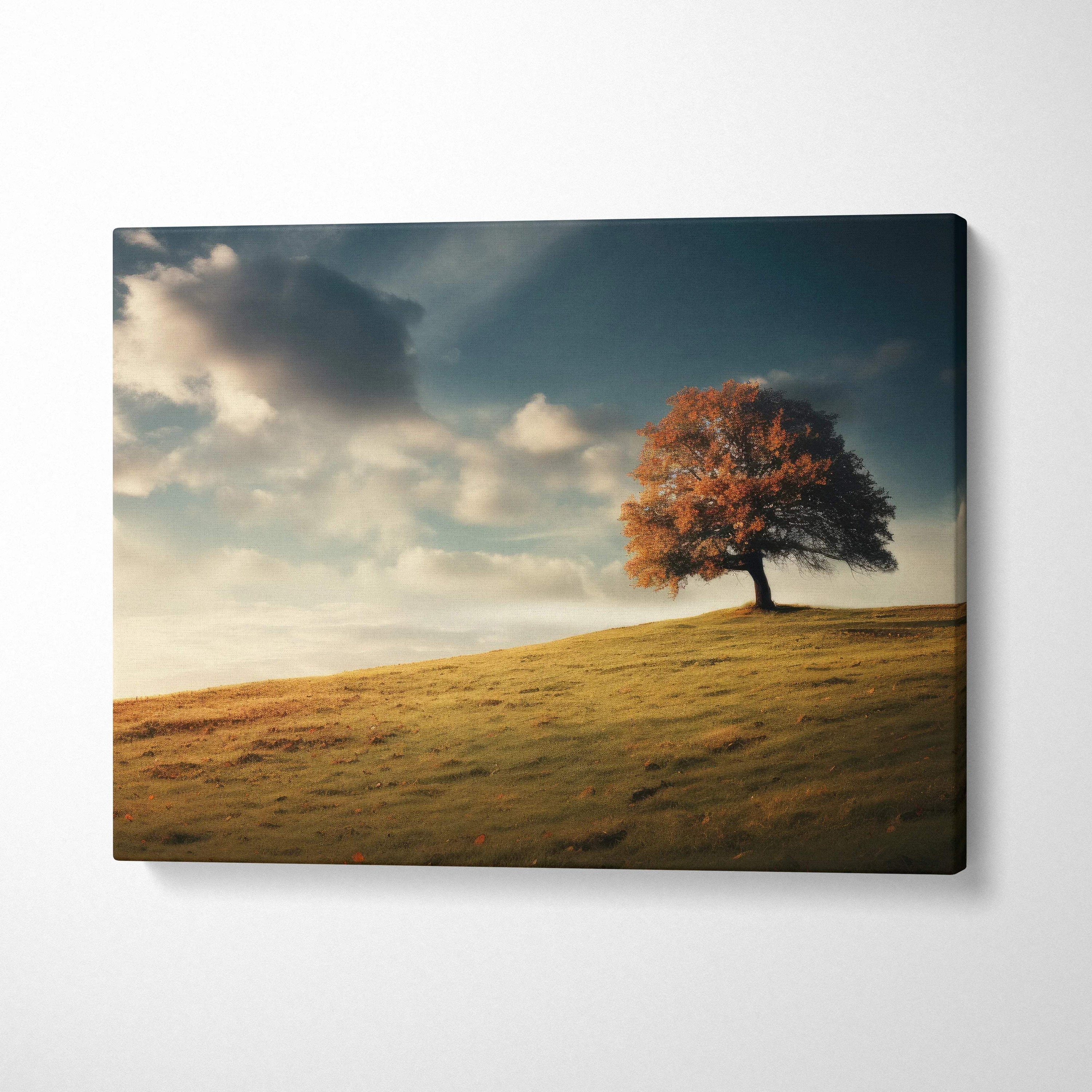 Autumn tree on hill under cloudy sky vibrant foliage canvas art wall decor.