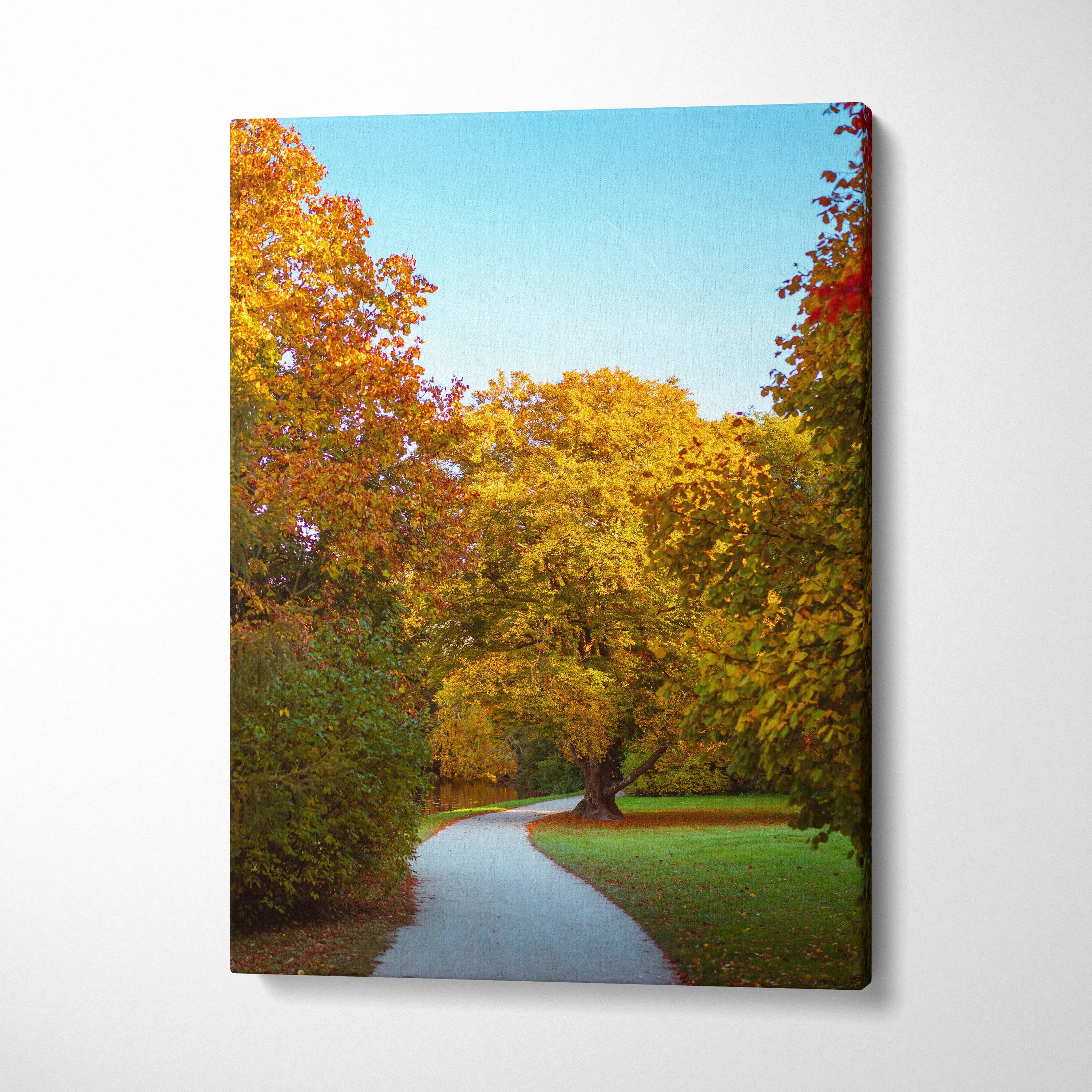 Vibrant autumn landscape with colorful trees and winding path on vertical canvas wall art.