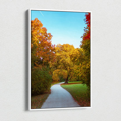 Vibrant autumn landscape canvas art showing a winding path through colorful fall trees under a clear blue sky.