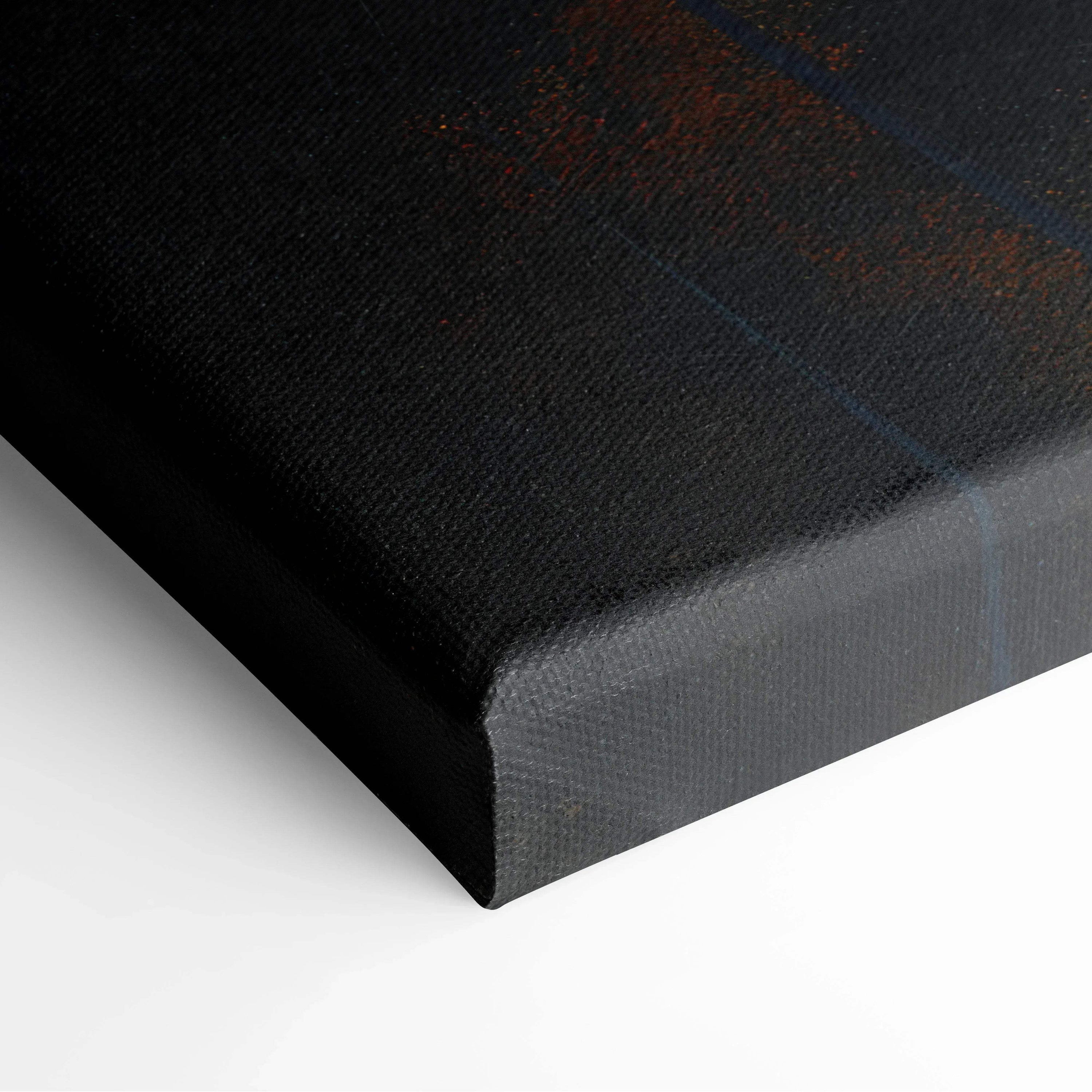 Close-up of black wrapped canvas art corner with textured surface and sharp edges.