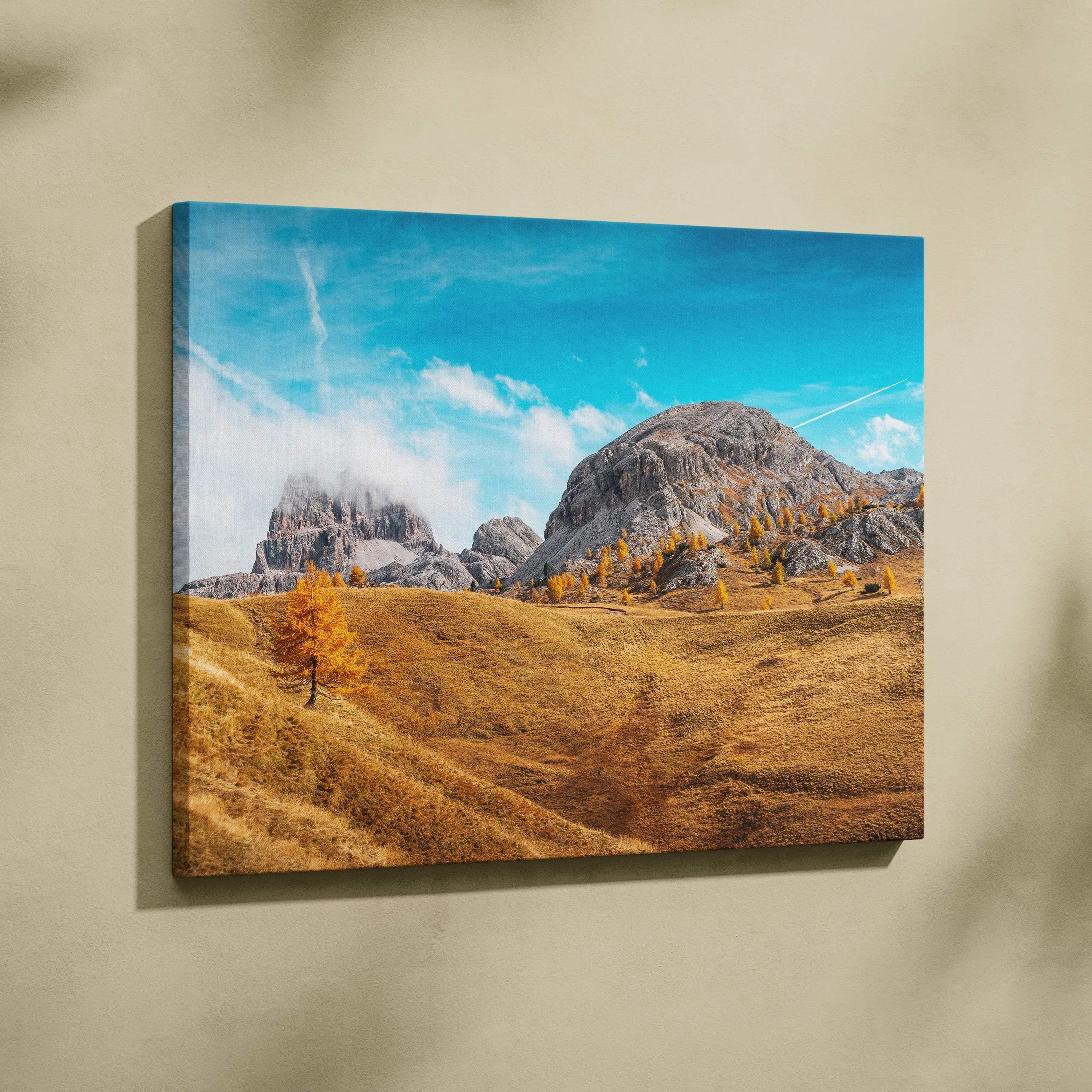 Autumn landscape canvas art with golden fields, vibrant trees, rocky mountains, and blue sky wall art.