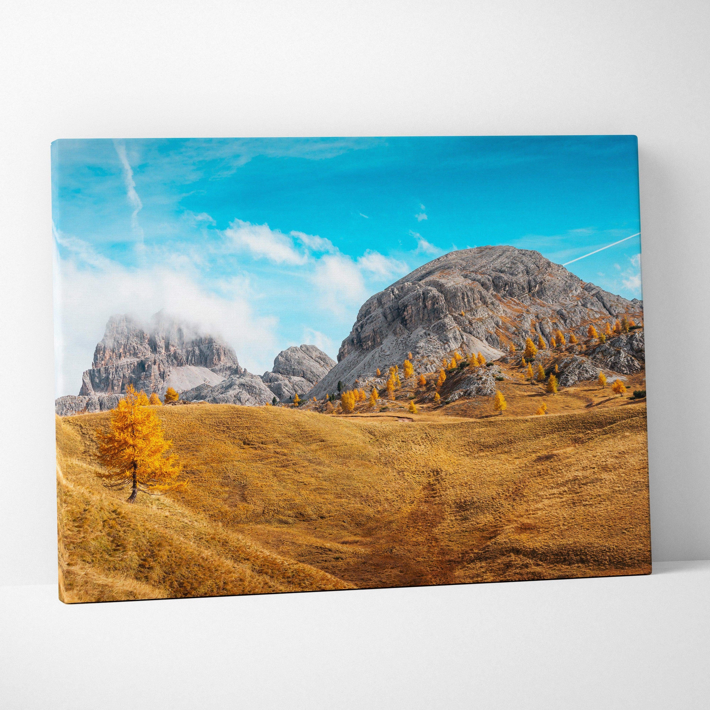Autumn landscape canvas art with golden trees and rocky mountains under a blue sky wall art.