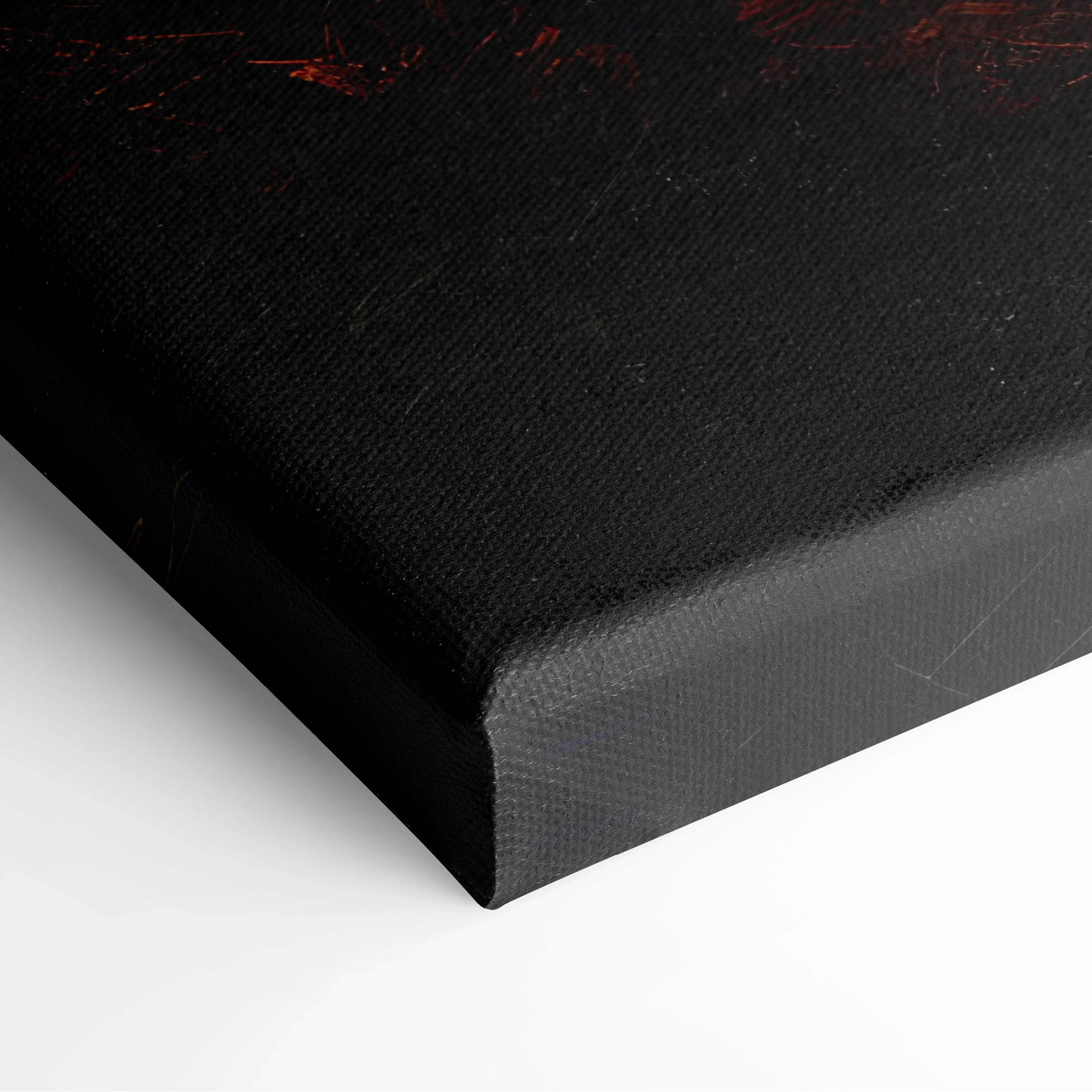 Corner close-up of black textured canvas art with subtle red highlights, wall art detail.