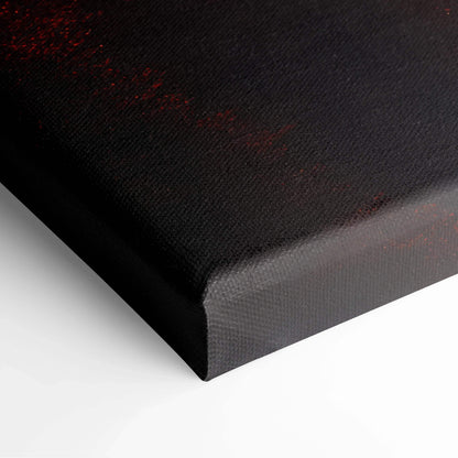 Close-up of black edge on canvas art with red and dark tones in wall art print texture.