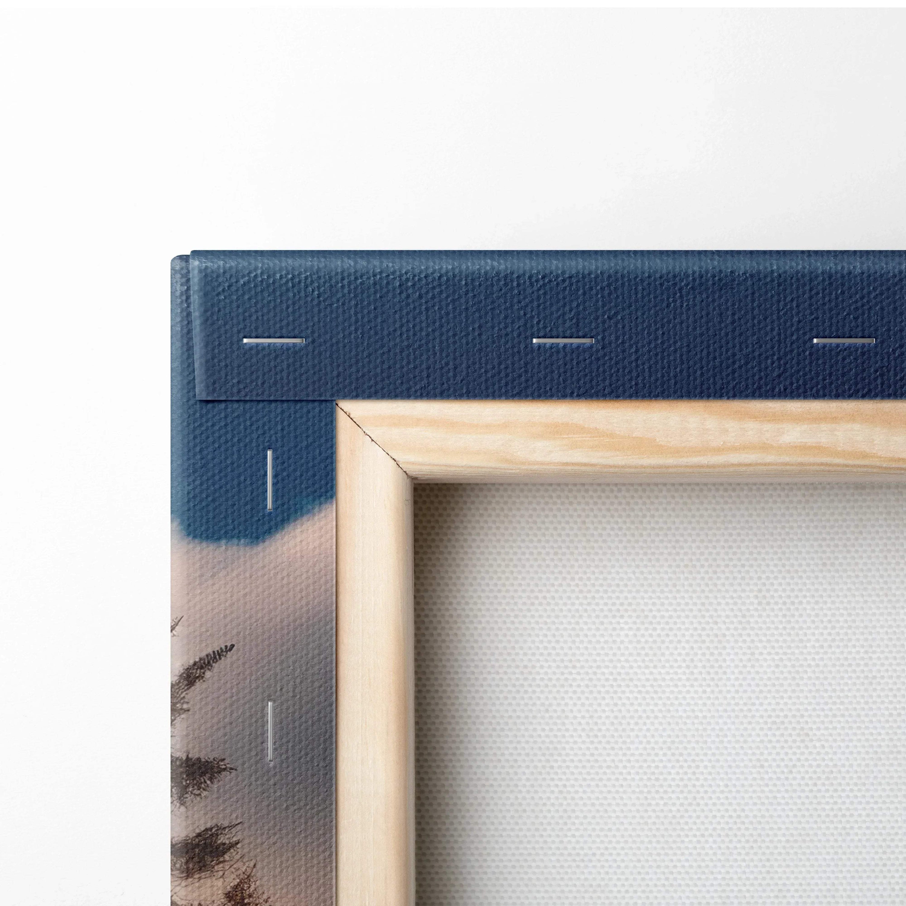 Close-up of canvas art corner with blue autumn mountain print and wooden frame for wall art.