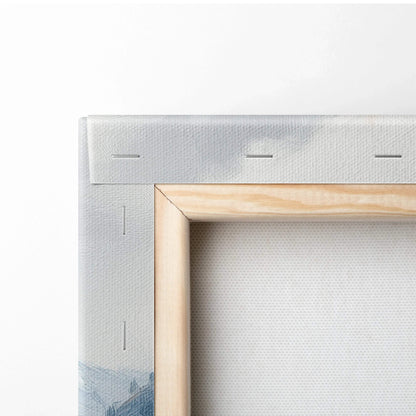 Close-up of stretched canvas art corner with wooden frame and visible mountain print on wall art.