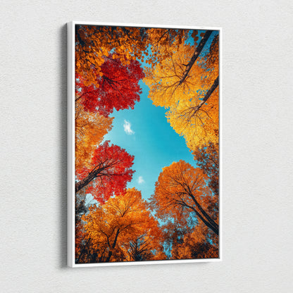 Vertical canvas wall art featuring vibrant red, orange, and yellow autumn leaves against a bright blue sky.
