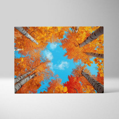 Canvas art with golden autumn tree foliage viewed from below against a bright blue sky, vibrant wall art.