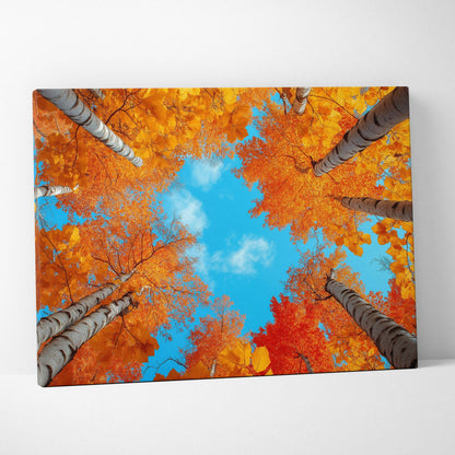 Canvas art featuring vibrant golden and orange autumn foliage against a bright blue sky, wall art with serene nature scene.