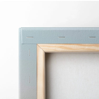 Light blue textured canvas frame with wood border, sunrise mountain art