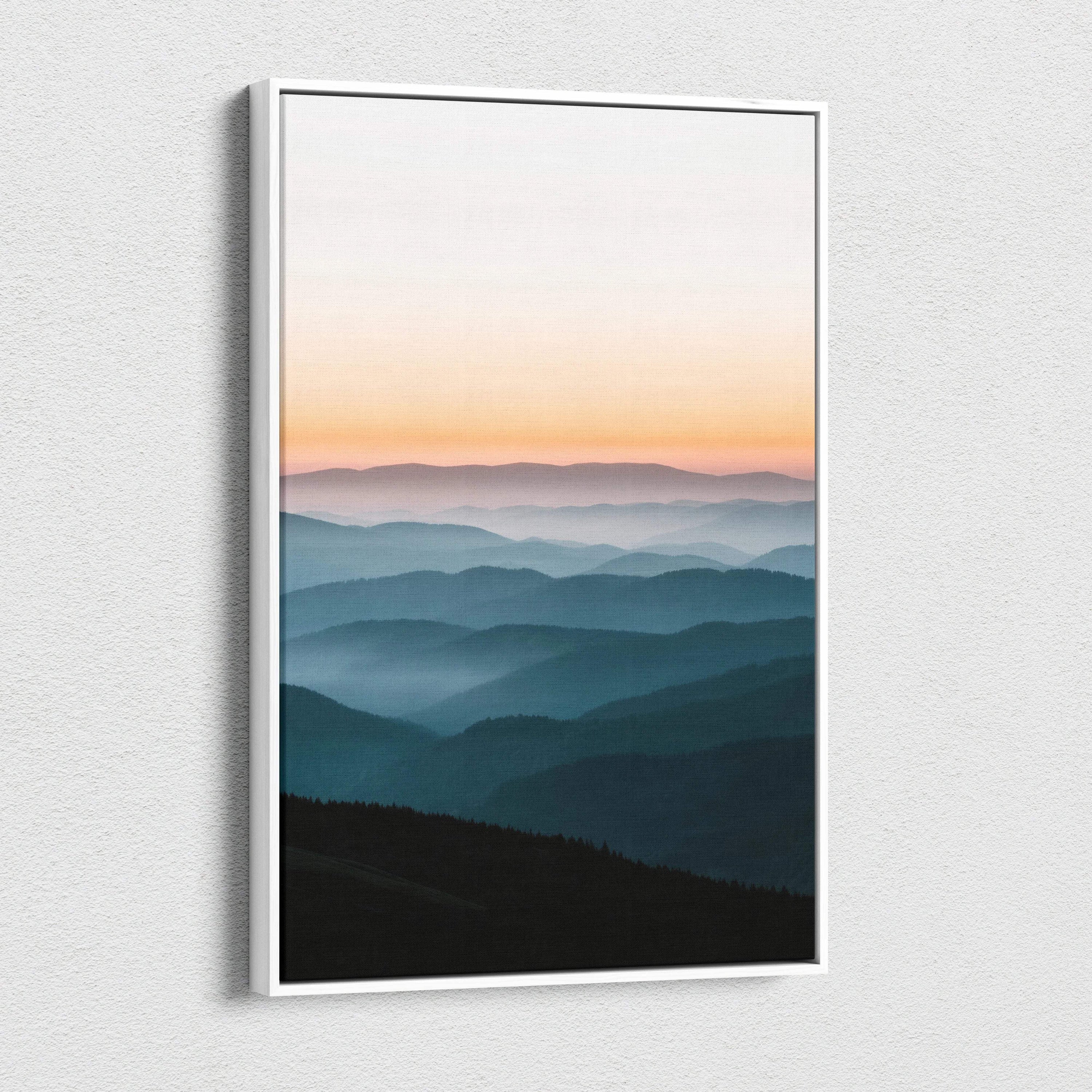 Minimalist canvas print of layered mountains under peach to blue sunset gradient sky