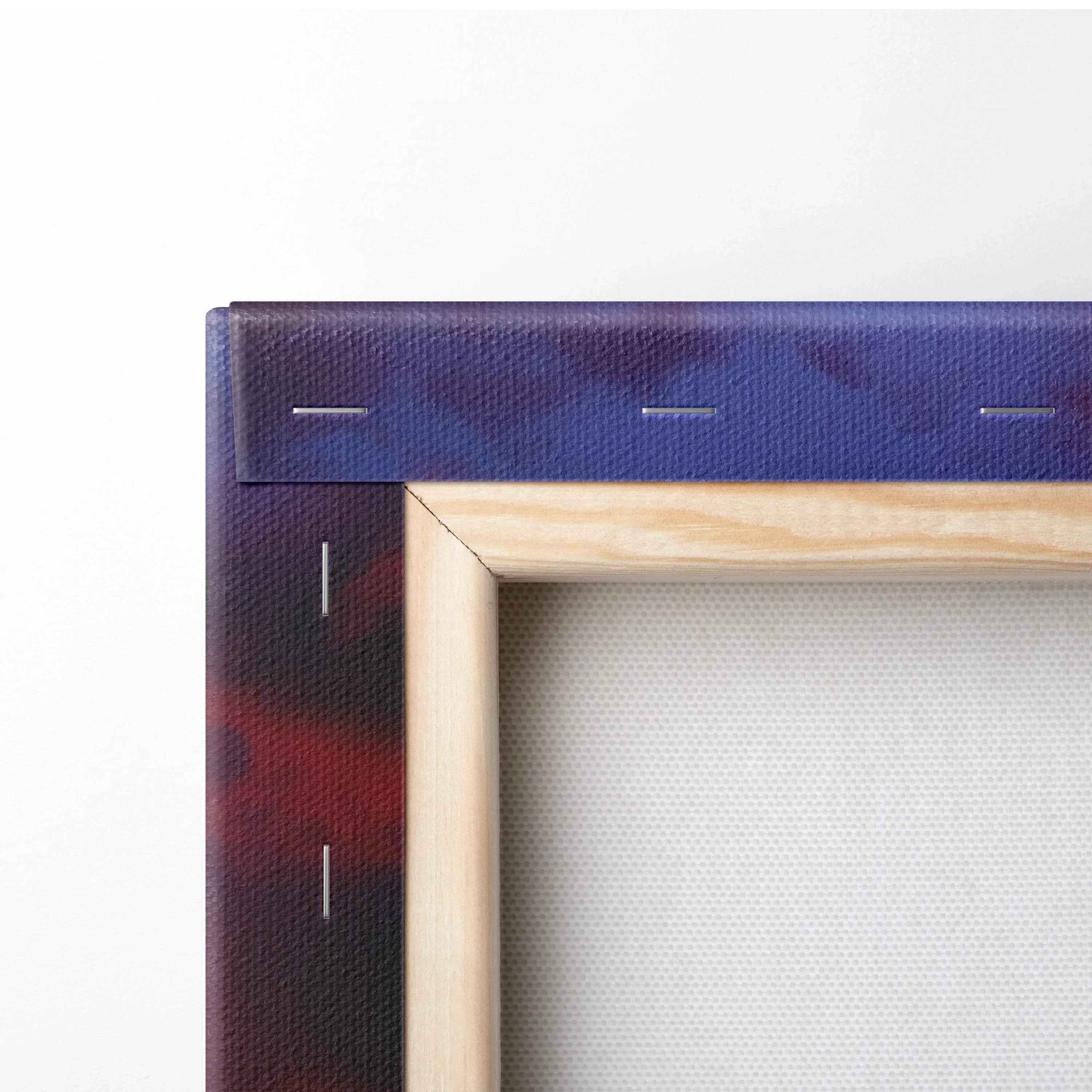 Back of serene landscape canvas wall art with blue-red gradient border on light wood stretcher bar