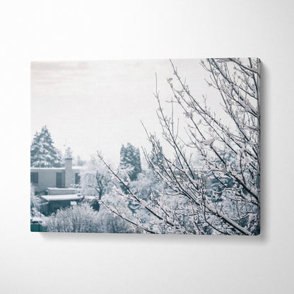 Winter canvas wall art showing snow-covered tree branches with soft, muted background decor tones.