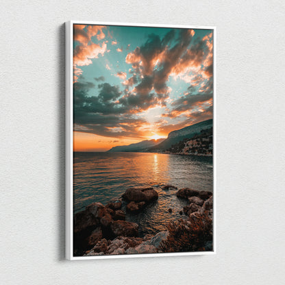 Canvas wall art featuring a dramatic beach sunset with orange and teal clouds over rocky shore and calm water.