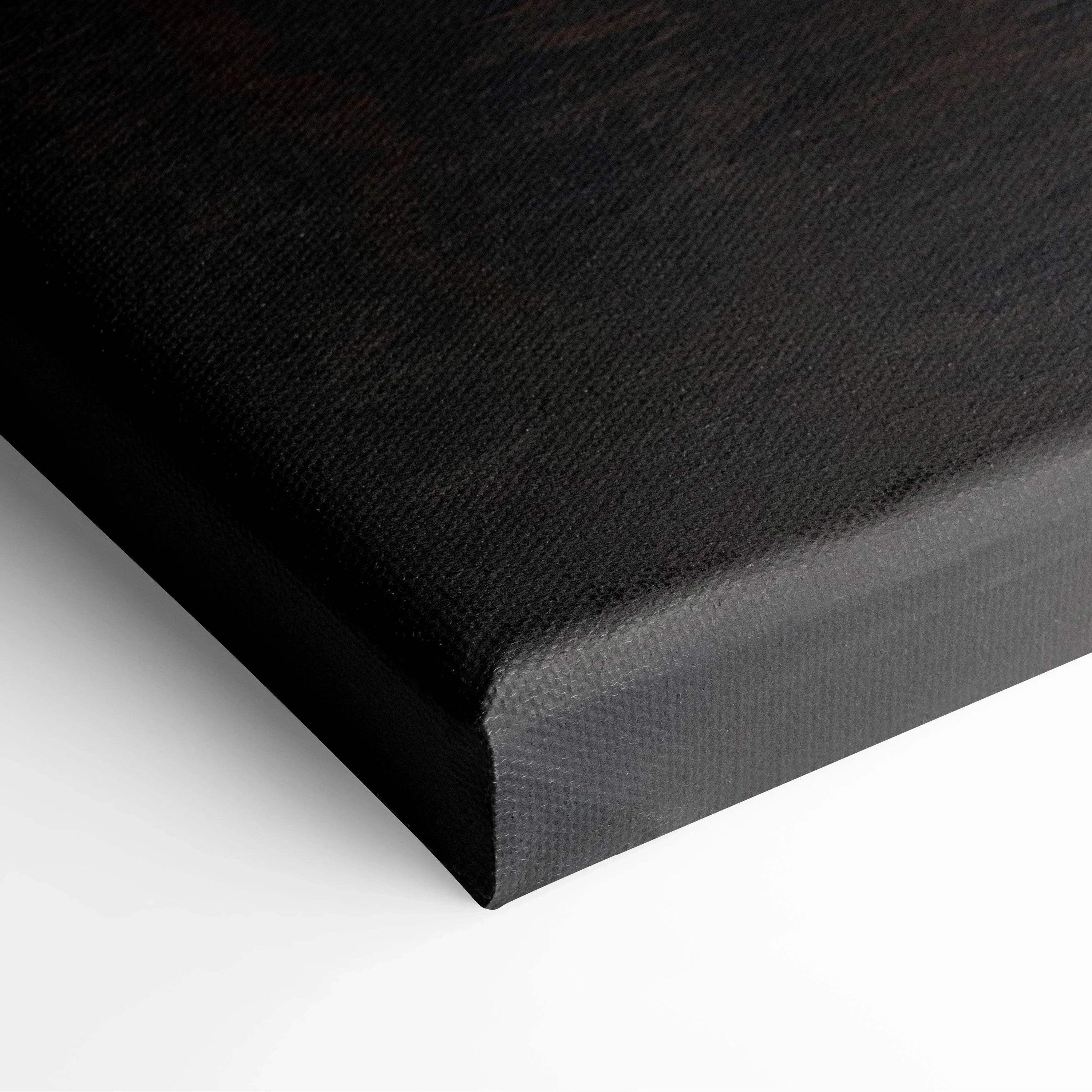 Black canvas stretched over wooden frame with fine texture, ready for wall art display.
