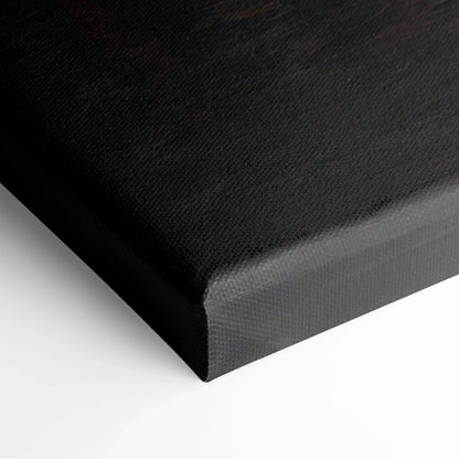 Black canvas stretched over wooden frame with fine texture, ready for wall art display.