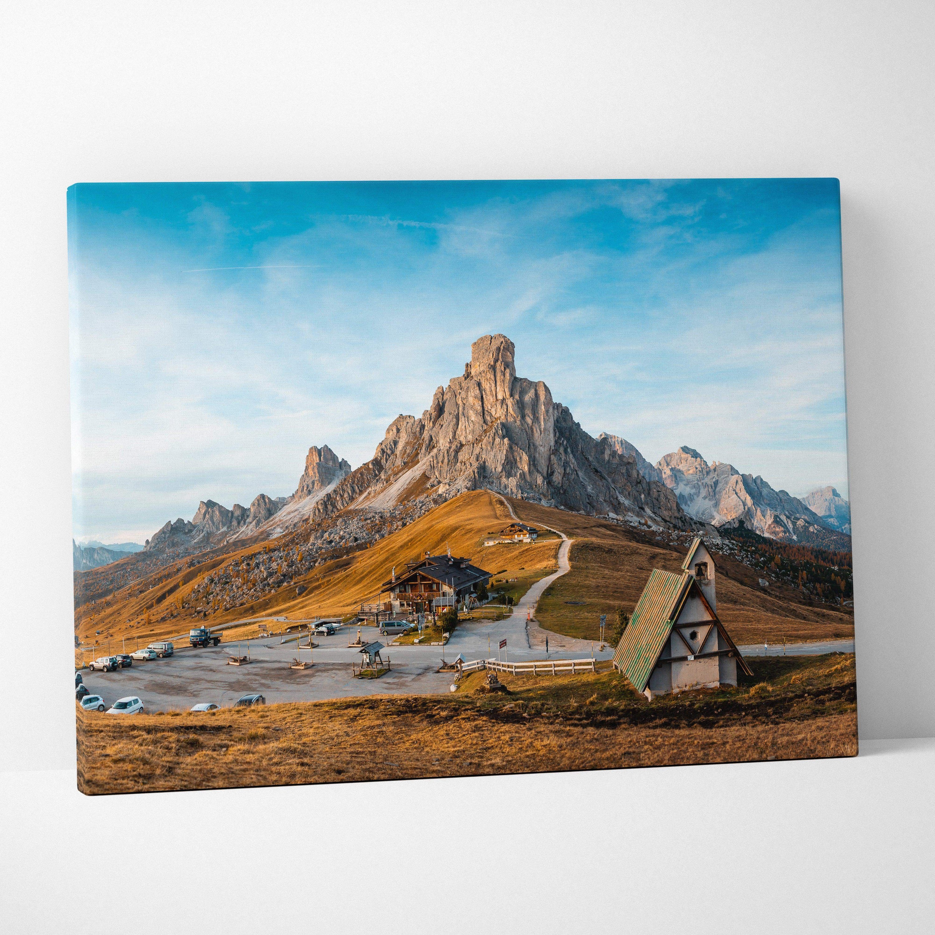 Canvas print of Dolomite Peaks, Giau Pass church, golden autumn hills