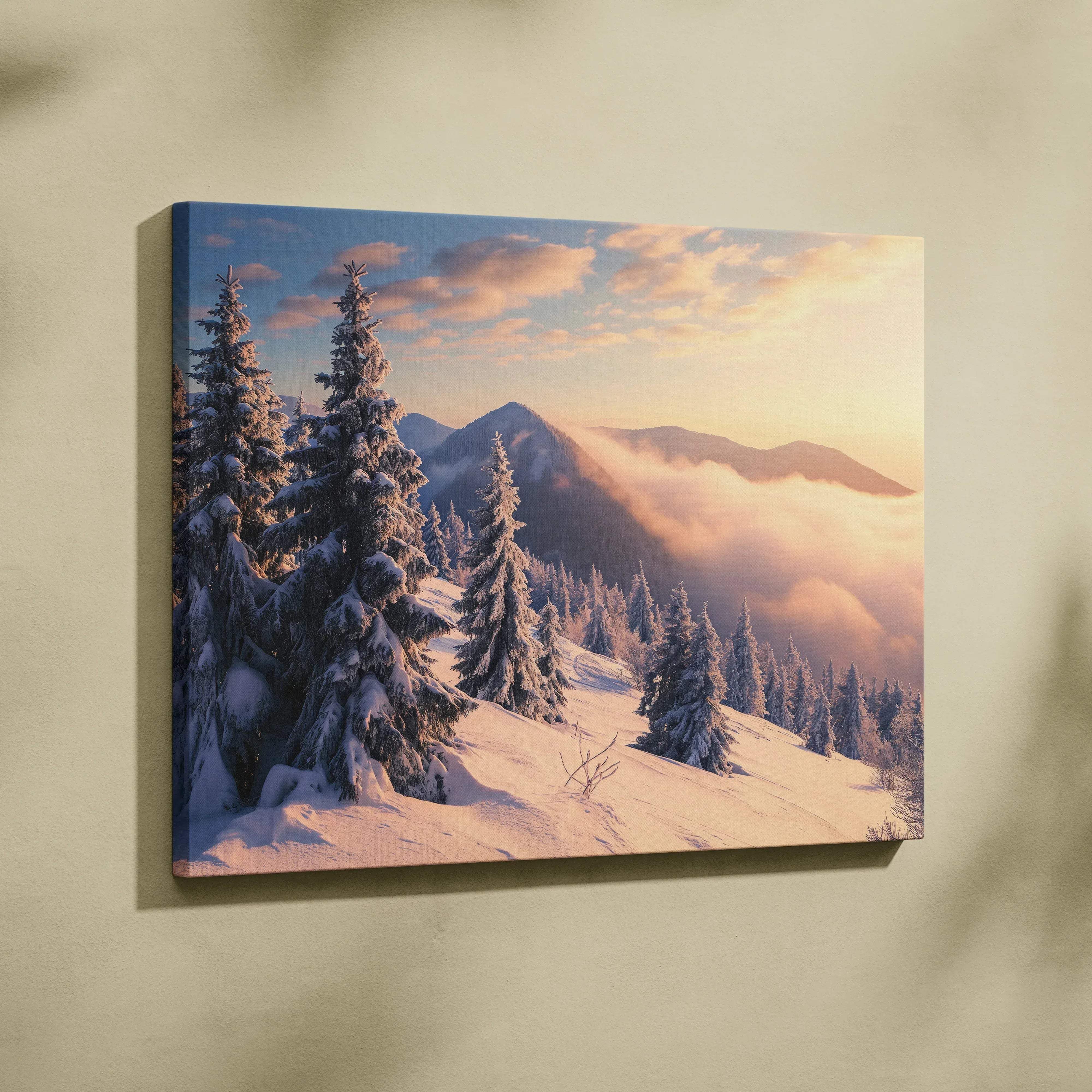 Framed canvas wall art featuring snow-covered pine trees against misty mountains under a warm golden sunrise light
