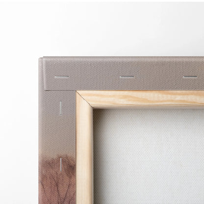 Close-up of stretched canvas corner with light wood frame and beige backing fabric for wall art decor.