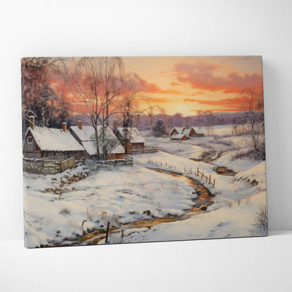 Canvas wall art featuring a snowy village landscape with a winding stream and vibrant orange sunset sky.