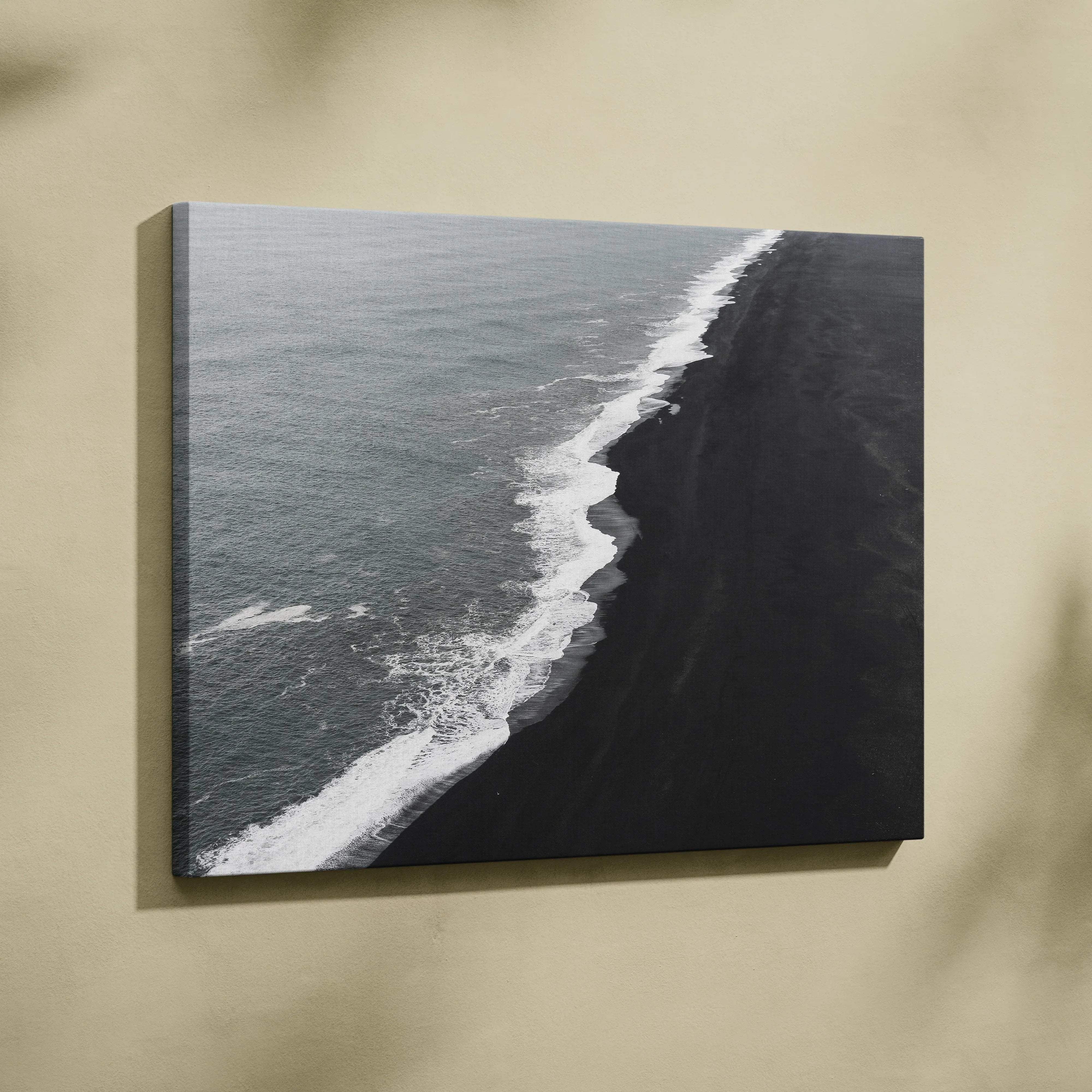 Black and white canvas print of Icelandic black sand beach waves crashing