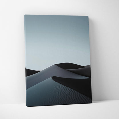 Minimalist black sand dunes canvas wall art with soft blue gradient sky, vertical decor print.