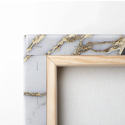 Canvas print with abstract digital art featuring gray and gold textured patterns on stretched fabric bordered by a natural.