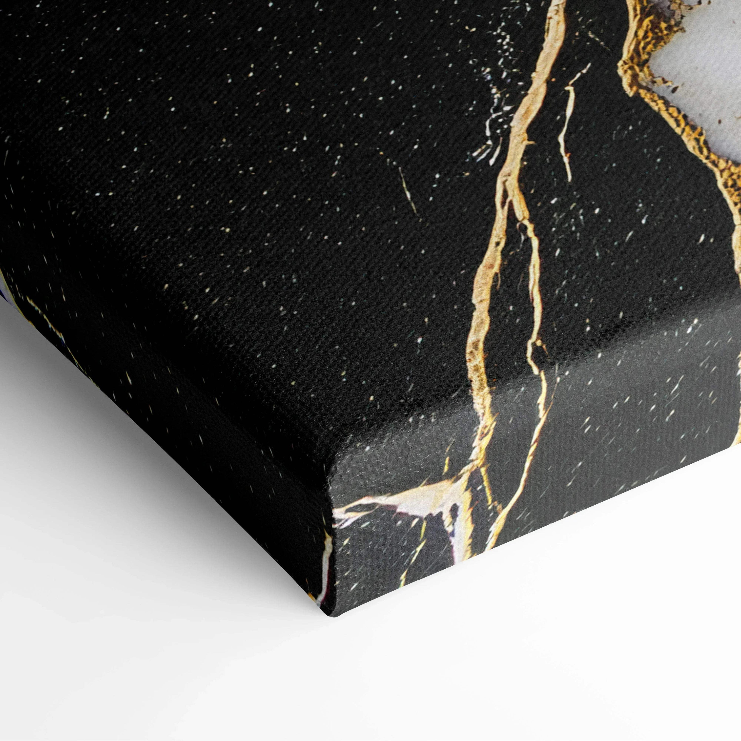 Black canvas art with gold and white abstract veins and speckled details on textured canvas surface.